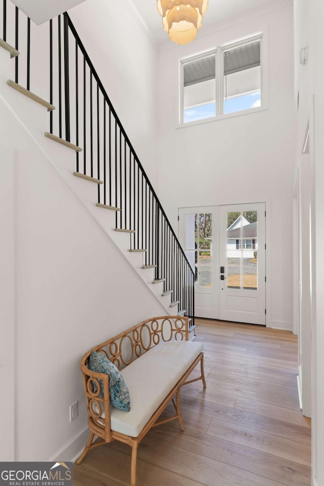 616 Neptune Way, Saint Simons, GA 31522 - foyer featuring a high ceiling, stairs, and hardwood / wood-style flooring