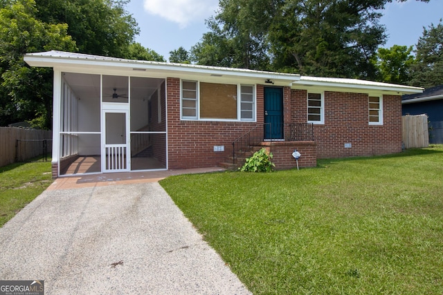 2642 Reynolds Dr, Macon, GA 31206 - view of front of property featuring a ceiling fan, a sunroom, brick siding, crawl space, and metal roof