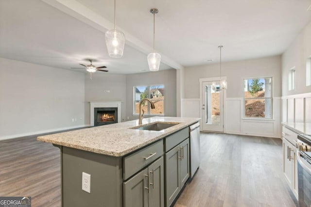 4502 Links Blvd, Jefferson, GA 30549 - kitchen featuring a sink, dishwasher, gray cabinetry, wood finished floors, and beam ceiling