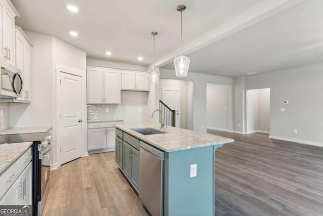 4502 Links Blvd, Jefferson, GA 30549 - kitchen featuring stainless steel appliances, a sink, recessed lighting, white cabinetry, and light wood-type flooring