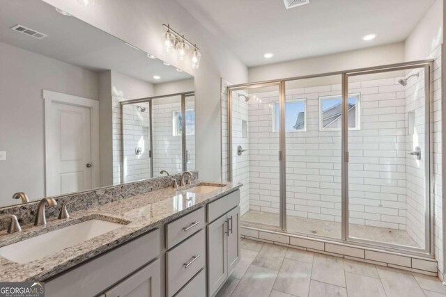 4502 Links Blvd, Jefferson, GA 30549 - bathroom with a shower stall, double vanity, and recessed lighting