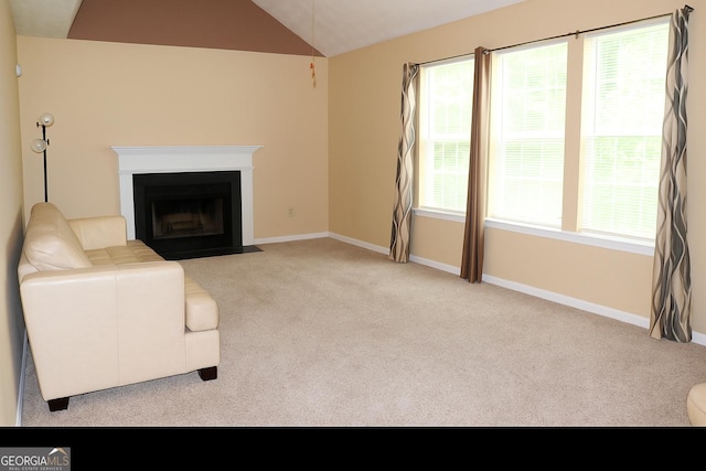 3255 Hunters Crossing Pt, Lithonia, GA 30038 - unfurnished living room featuring lofted ceiling, carpet, baseboards, and healthy amount of natural light