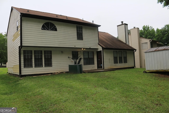3255 Hunters Crossing Pt, Lithonia, GA 30038 - back of house with a yard and a chimney