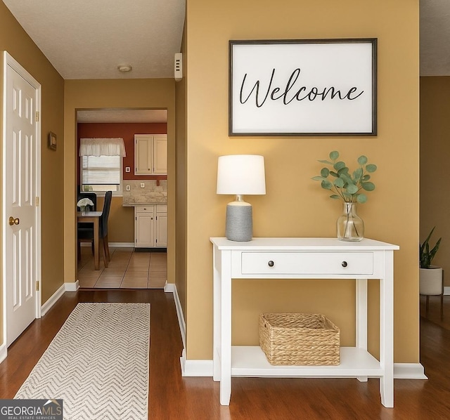 3255 Hunters Crossing Pt, Lithonia, GA 30038 - corridor featuring dark wood-style flooring and baseboards