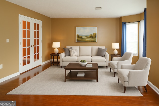 3255 Hunters Crossing Pt, Lithonia, GA 30038 - living room with wood finished floors, french doors, and baseboards