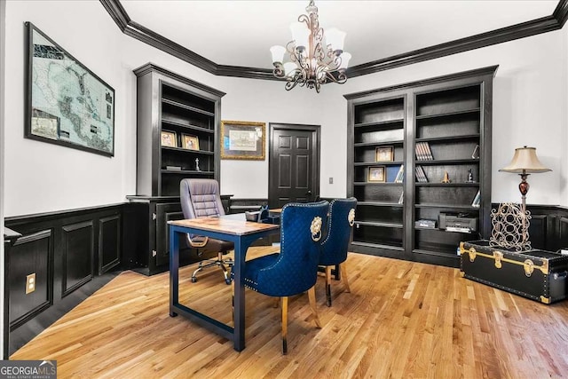 4670 Hamden Forest Dr SW, Atlanta, GA 30331 - office featuring crown molding, a chandelier, built in features, a wainscoted wall, and light wood-style floors