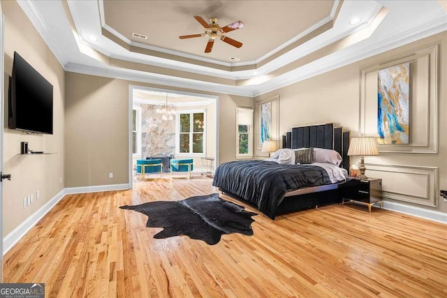 4670 Hamden Forest Dr SW, Atlanta, GA 30331 - bedroom featuring crown molding, wood finished floors, a raised ceiling, and ceiling fan