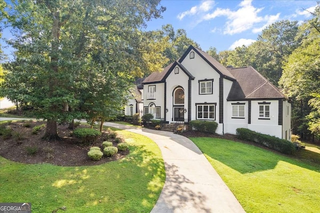 4670 Hamden Forest Dr SW, Atlanta, GA 30331 - view of front facade featuring stucco siding, a front lawn, and roof with shingles