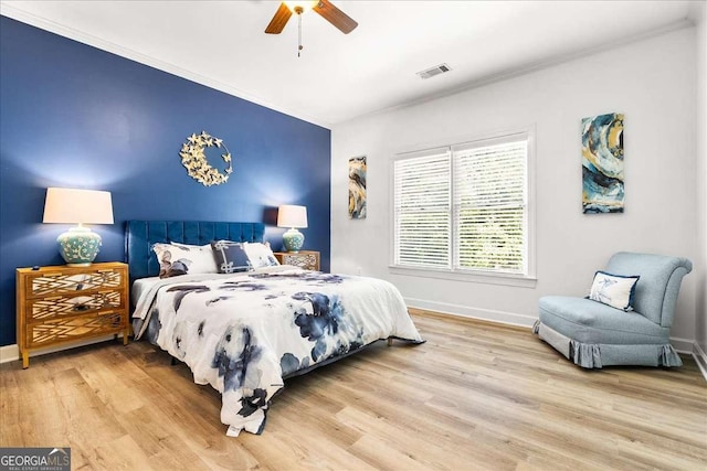 4670 Hamden Forest Dr SW, Atlanta, GA 30331 - bedroom with crown molding, wood finished floors, and a ceiling fan