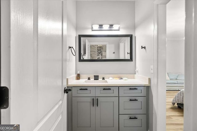 4670 Hamden Forest Dr SW, Atlanta, GA 30331 - ensuite bathroom with vanity and wood finished floors