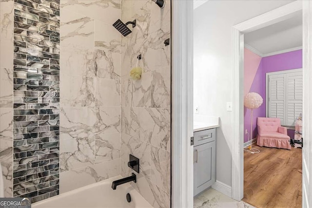 4670 Hamden Forest Dr SW, Atlanta, GA 30331 - full bathroom featuring ornamental molding, vanity, shower / bathtub combination, and marble look tile flooring