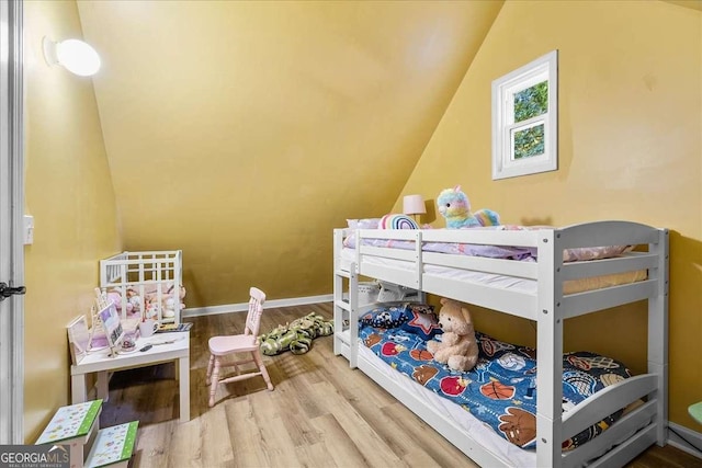 4670 Hamden Forest Dr SW, Atlanta, GA 30331 - bedroom with lofted ceiling and wood finished floors