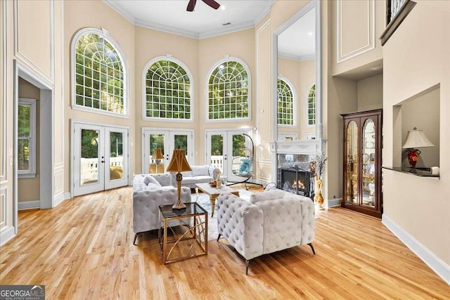 4670 Hamden Forest Dr SW, Atlanta, GA 30331 - living area with french doors, a high ceiling, a premium fireplace, ceiling fan, and plenty of natural light
