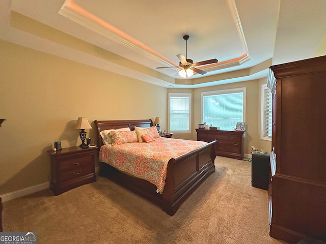 307 Legacy Park Dr, Perry, GA 31069 - bedroom with a raised ceiling, light carpet, and ceiling fan