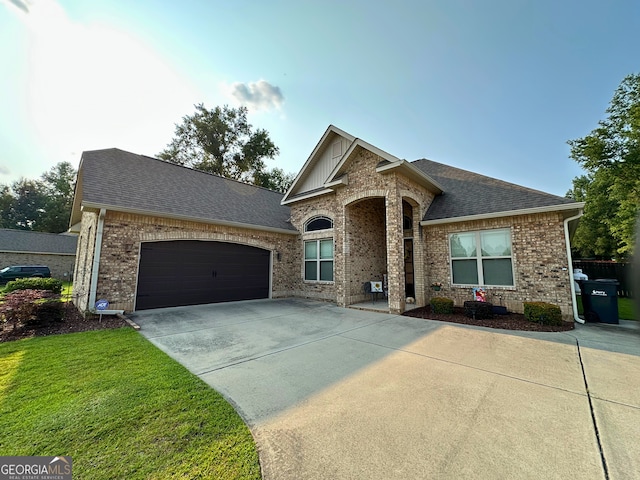 307 Legacy Park Dr, Perry, GA 31069 - french country inspired facade featuring brick siding, roof with shingles, driveway, and an attached garage