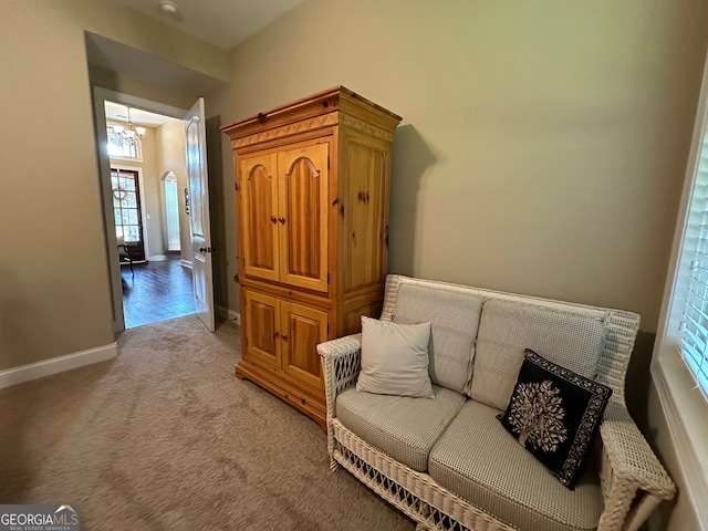 307 Legacy Park Dr, Perry, GA 31069 - living area with plenty of natural light, light carpet, and a chandelier
