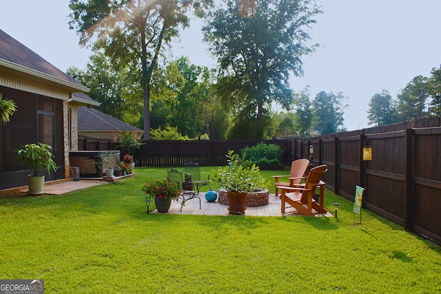 307 Legacy Park Dr, Perry, GA 31069 - fenced backyard with a patio area