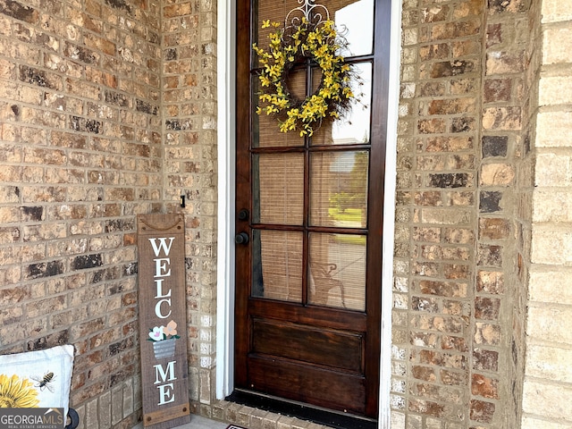 307 Legacy Park Dr, Perry, GA 31069 - doorway to property featuring brick siding