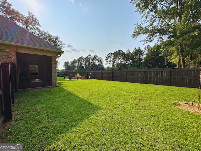307 Legacy Park Dr, Perry, GA 31069 - fenced backyard featuring a sunroom