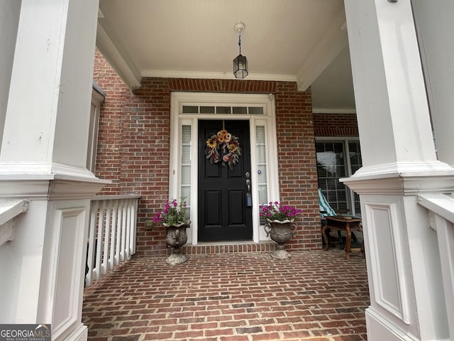 2123 Floral Ridge Dr, Dacula, GA 30019 - doorway to property featuring brick siding and covered porch