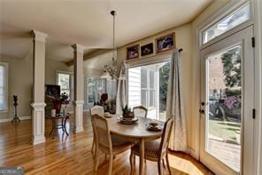 2123 Floral Ridge Dr, Dacula, GA 30019 - dining space with ornate columns and wood finished floors