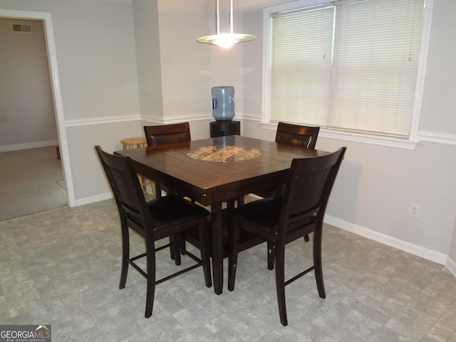 2958 Mary Alice Trl, Loganville, GA 30052 - dining area featuring baseboards and light flooring