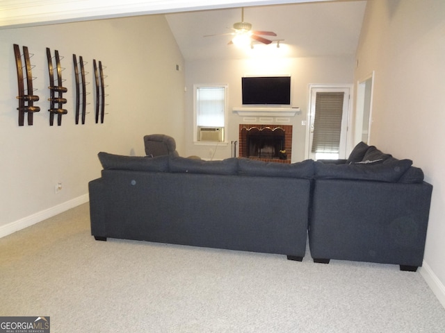 2958 Mary Alice Trl, Loganville, GA 30052 - living area with carpet flooring, a ceiling fan, baseboards, lofted ceiling, and a brick fireplace