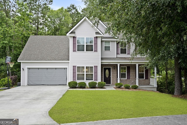 102 Brookstone Way, Rincon, GA 31326 - traditional-style house with a garage, concrete driveway, a front yard, a porch, and roof with shingles