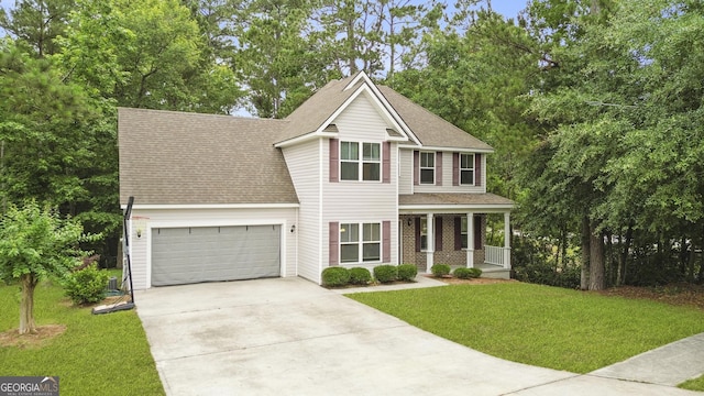 102 Brookstone Way, Rincon, GA 31326 - view of front of home with covered porch, concrete driveway, an attached garage, a front yard, and roof with shingles