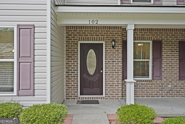 102 Brookstone Way, Rincon, GA 31326 - property entrance featuring brick siding and a porch