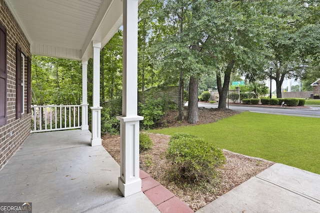 102 Brookstone Way, Rincon, GA 31326 - covered porch featuring a lawn