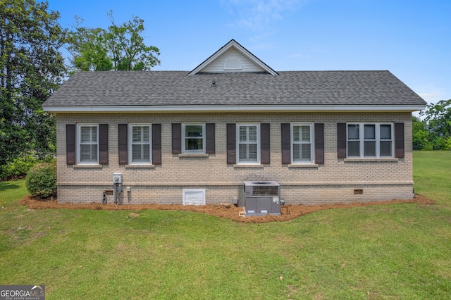 7443 Church St, Bartow, GA 30413 - view of side of home with a shingled roof, a yard, central AC, and brick siding