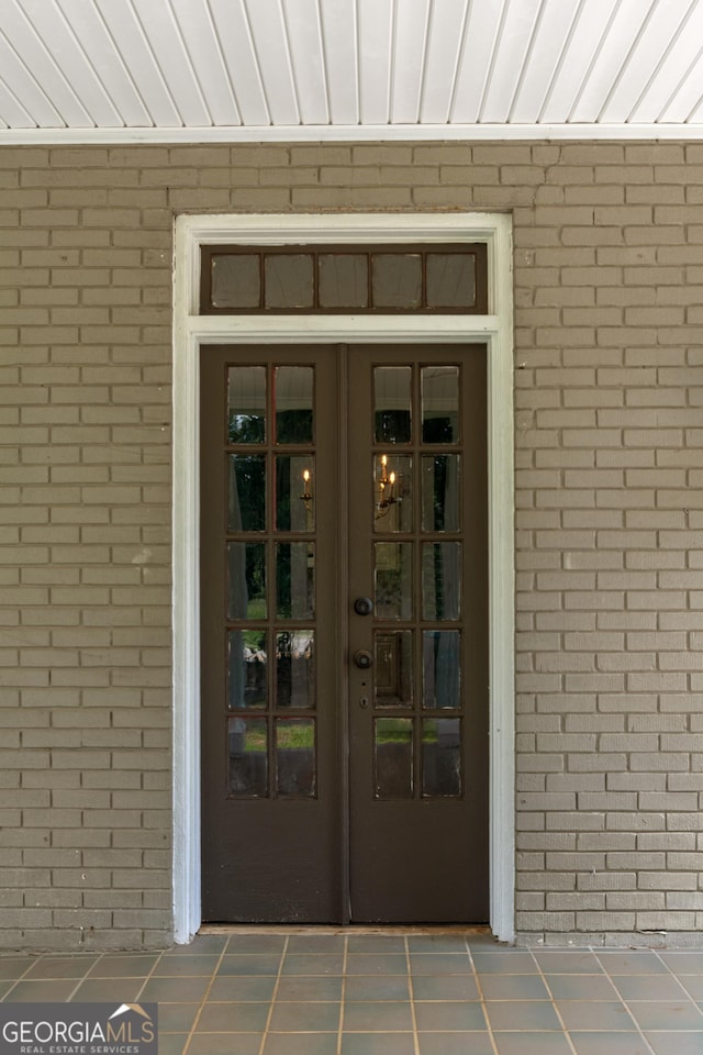 7443 Church St, Bartow, GA 30413 - property entrance featuring brick siding and french doors