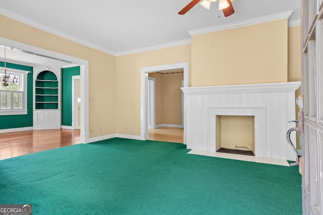 7443 Church St, Bartow, GA 30413 - unfurnished living room with ornamental molding, ceiling fan, a fireplace, baseboards, and a chandelier
