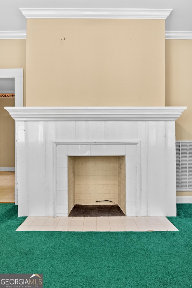 7443 Church St, Bartow, GA 30413 - detailed view of crown molding, a tile fireplace, and carpet flooring