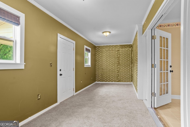 7443 Church St, Bartow, GA 30413 - spare room with ornamental molding, brick wall, baseboards, and carpet