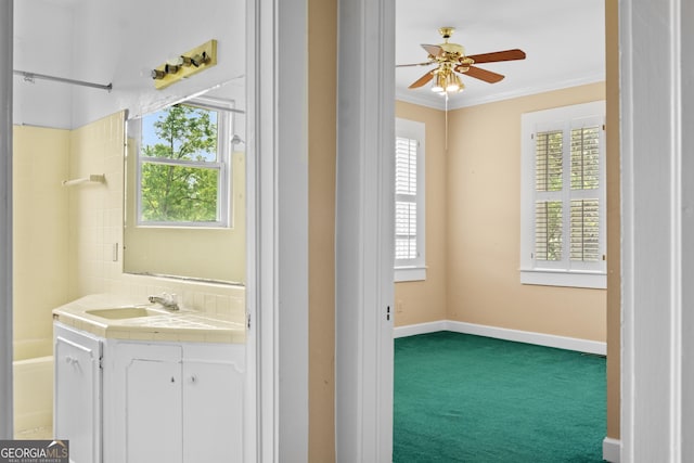 7443 Church St, Bartow, GA 30413 - full bathroom with vanity, crown molding, ceiling fan, bathtub / shower combination, and tasteful backsplash