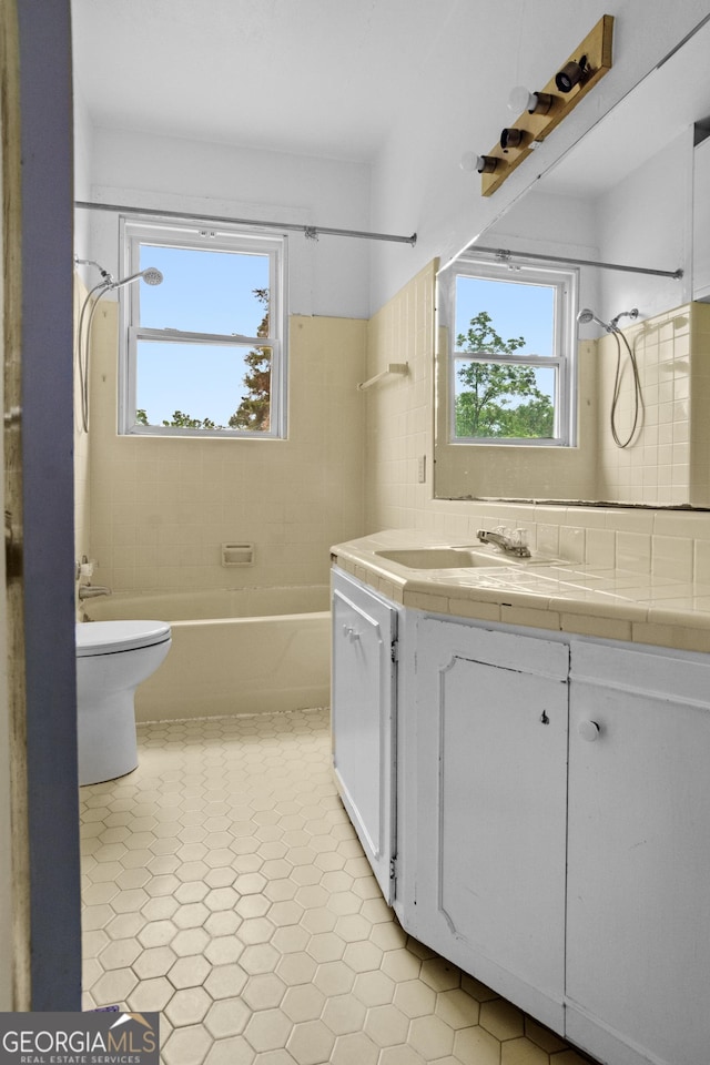 7443 Church St, Bartow, GA 30413 - bathroom with vanity, toilet, and tub / shower combination