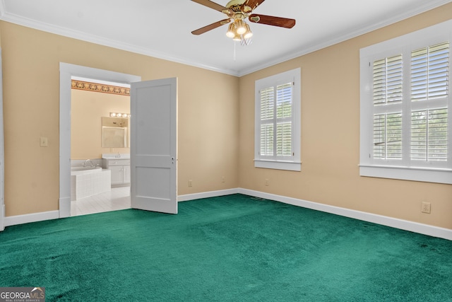 7443 Church St, Bartow, GA 30413 - unfurnished bedroom featuring ornamental molding, baseboards, carpet floors, connected bathroom, and a ceiling fan