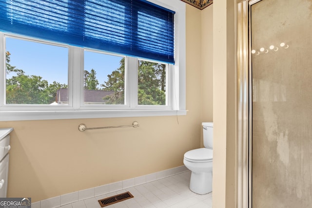 7443 Church St, Bartow, GA 30413 - full bath featuring tile patterned flooring, baseboards, a shower stall, and toilet