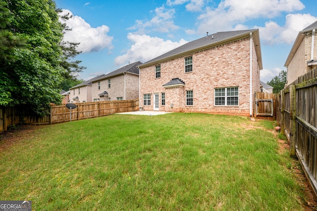 1076 Scenic Park Trl, Lawrenceville, GA 30046 - back of house featuring brick siding, a patio area, and a fenced backyard