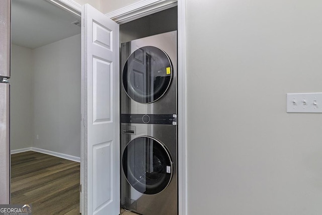 2065 Freeman St, Macon, GA 31201 - laundry area featuring stacked washing machine and dryer, wood finished floors, and baseboards