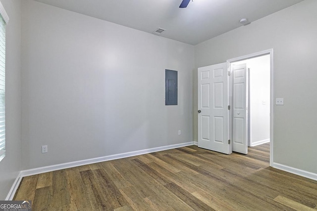 2065 Freeman St, Macon, GA 31201 - empty room with electric panel, wood finished floors, and baseboards