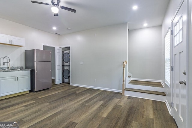 2065 Freeman St, Macon, GA 31201 - kitchen featuring freestanding refrigerator, stacked washer / dryer, a sink, dark wood-style flooring, and recessed lighting