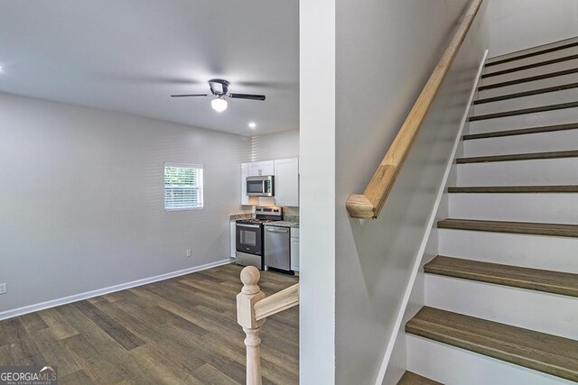 2065 Freeman St, Macon, GA 31201 - stairway with a ceiling fan, wood finished floors, and baseboards