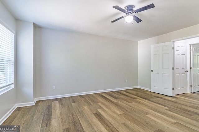2065 Freeman St, Macon, GA 31201 - empty room with plenty of natural light, ceiling fan, and wood finished floors
