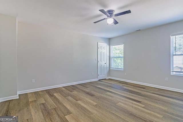 2065 Freeman St, Macon, GA 31201 - spare room featuring wood finished floors, plenty of natural light, a ceiling fan, and baseboards