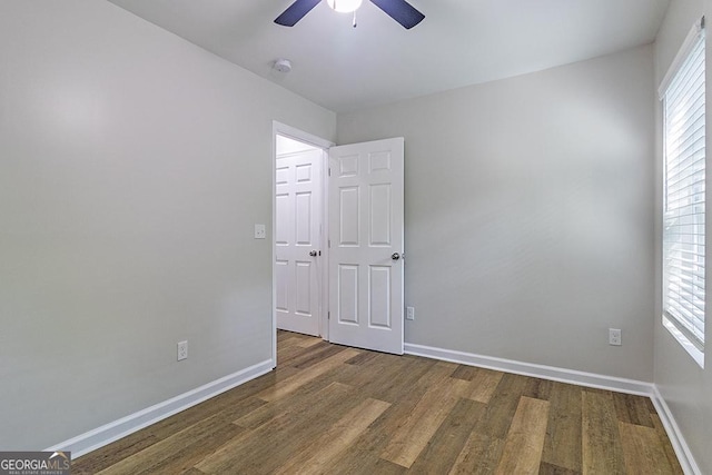 2065 Freeman St, Macon, GA 31201 - empty room with wood finished floors, ceiling fan, baseboards, and a smoke detector