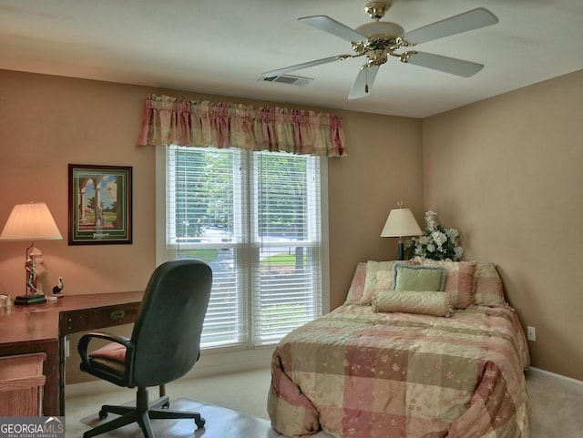 307 Worthing Ln, Mcdonough, GA 30253 - carpeted bedroom with multiple windows, a desk, and ceiling fan