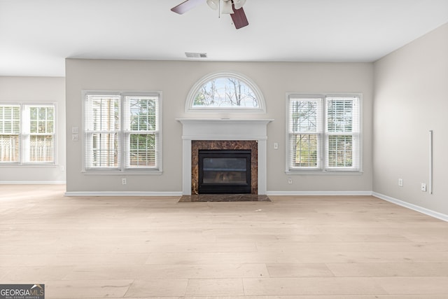 2030 Brook Meadow Dr, Alpharetta, GA 30005 - unfurnished living room featuring light wood-style flooring, plenty of natural light, and a ceiling fan
